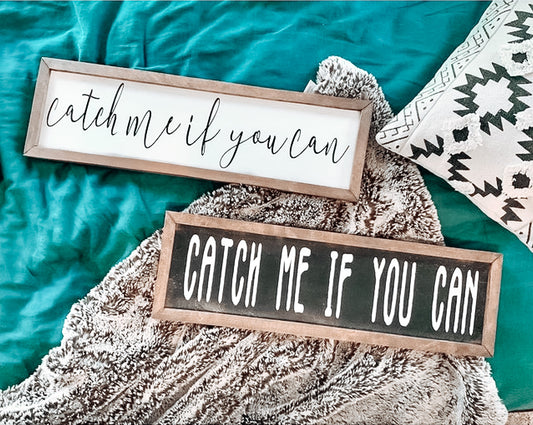 A modern boho style word sign with black background and white letters ‘Catch Me If You Can’, made for kids that are always on the go! Add the finishing touches to their gallery wall, by Handmade Nest Co.